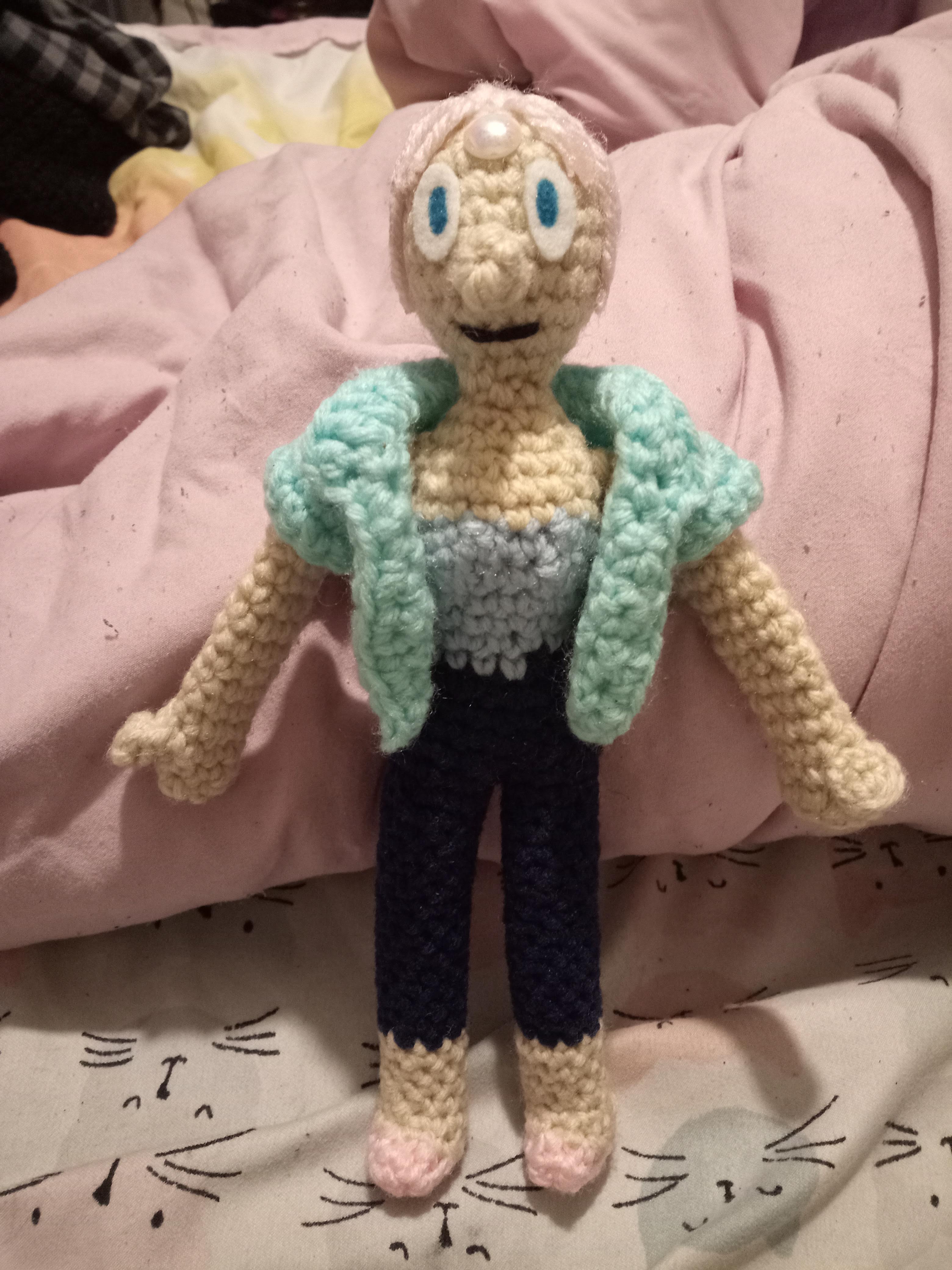 a front view of a crocheted Pearl from Steven Universe