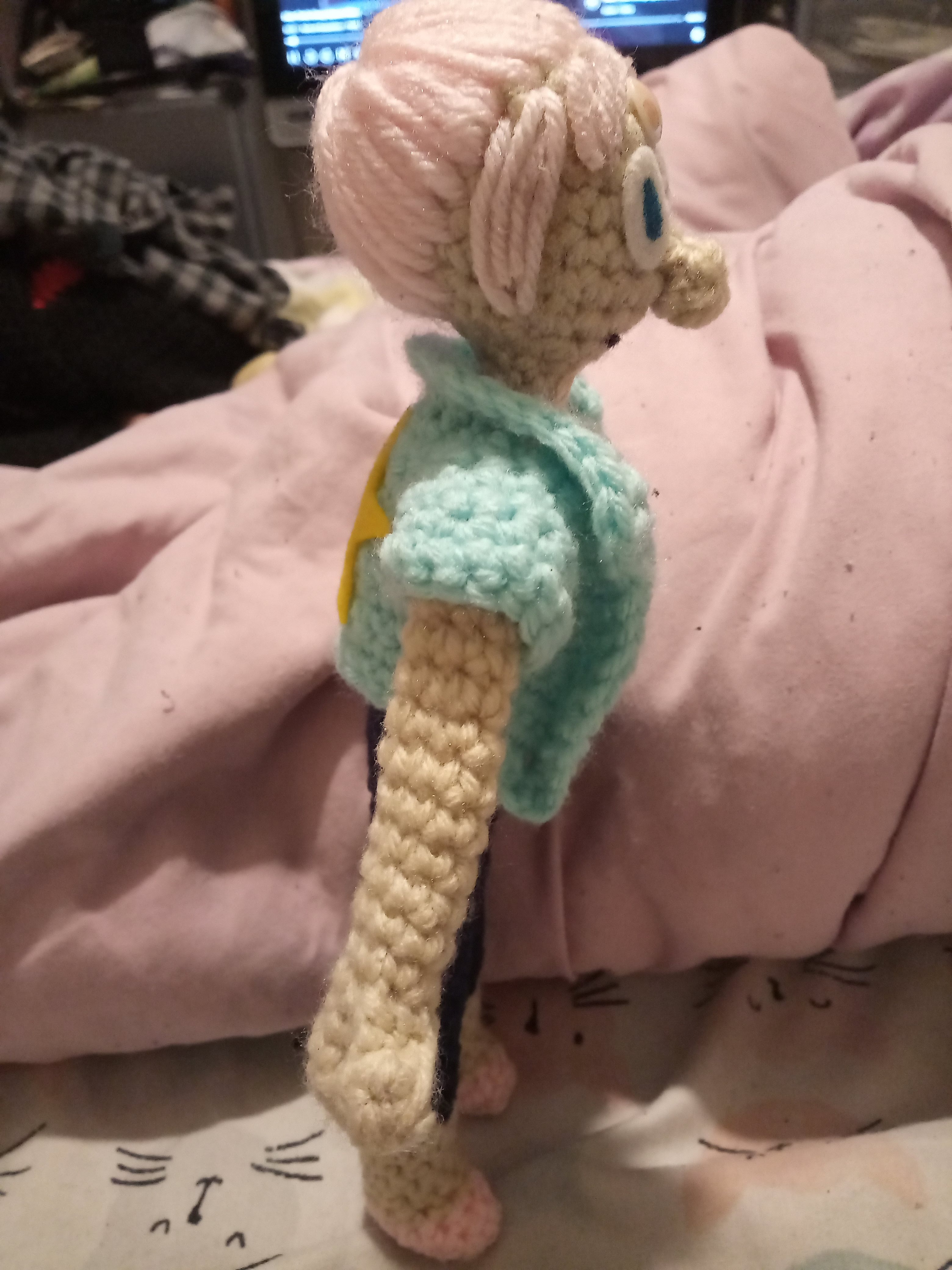 a side view of a crocheted Pearl from Steven Universe